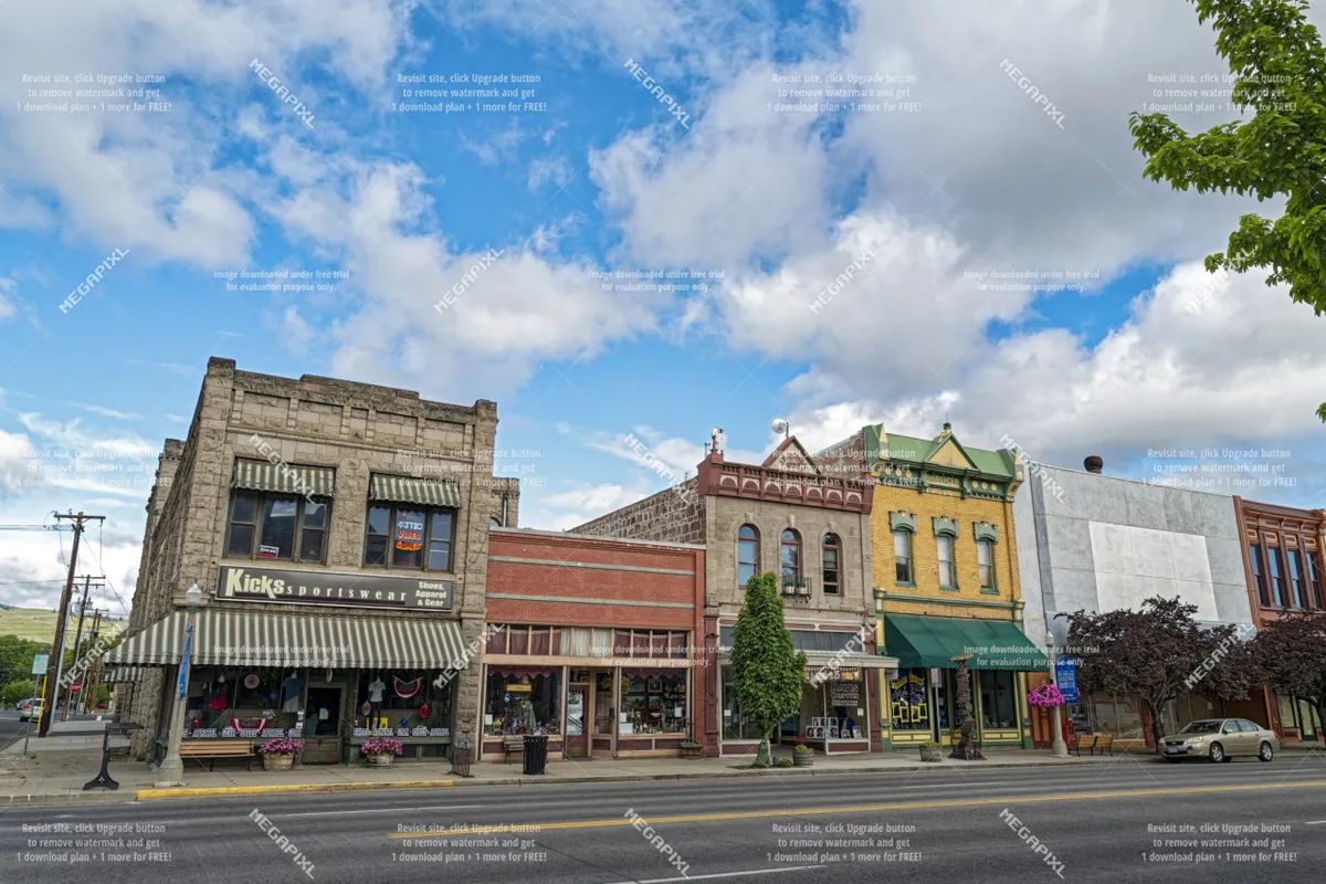 A lively street scene with a local sportswear shop, colorful historic facades, tree-lined sidewalks, and visible neighboring cafes and shops. The atmosphere is vibrant and walkable.